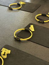 Yellow resistance bands on black mats
